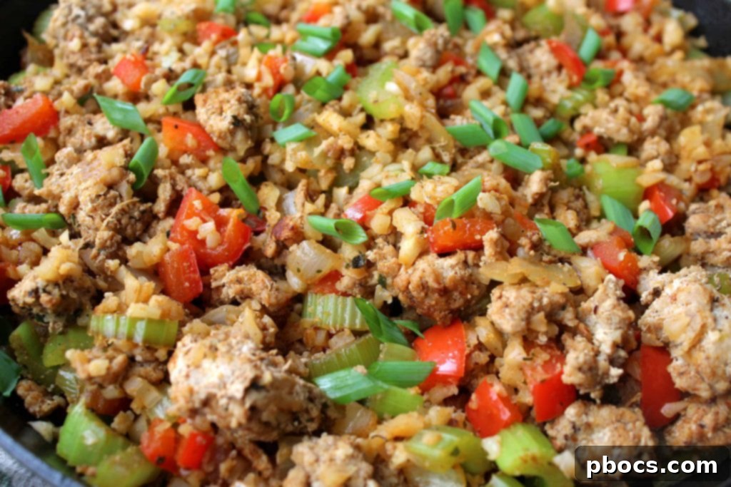 Savory Keto Dirty Cauliflower Rice with fresh vegetables and ground meat