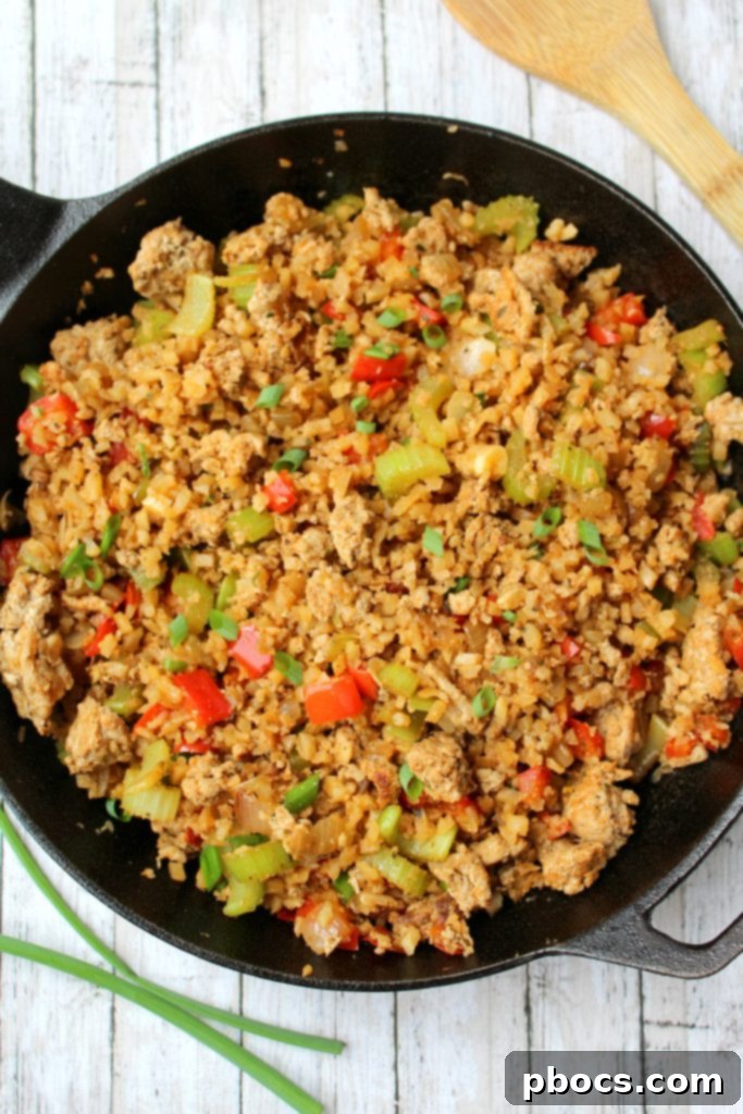 Keto Dirty Cauliflower Rice cooking in a single skillet, showcasing ease of preparation