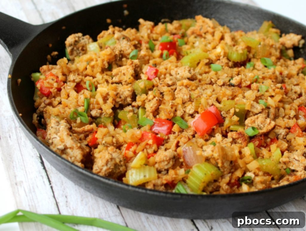 Cooked Keto Dirty Cauliflower Rice in a skillet, ready for meal prepping