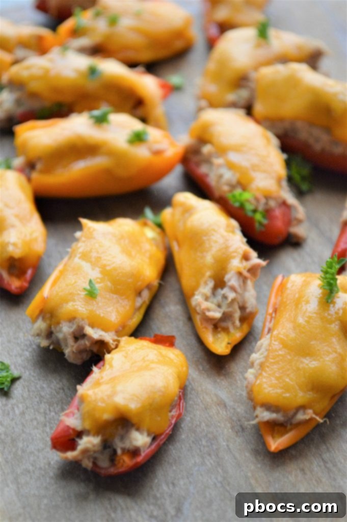 Cheesy Keto Tuna Poppers 4 Cheese melting on Keto Tuna Melt Poppers during baking.