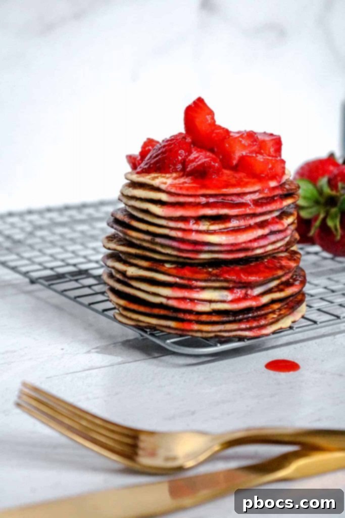 Stack of freshly cooked Keto Strawberry Pancakes