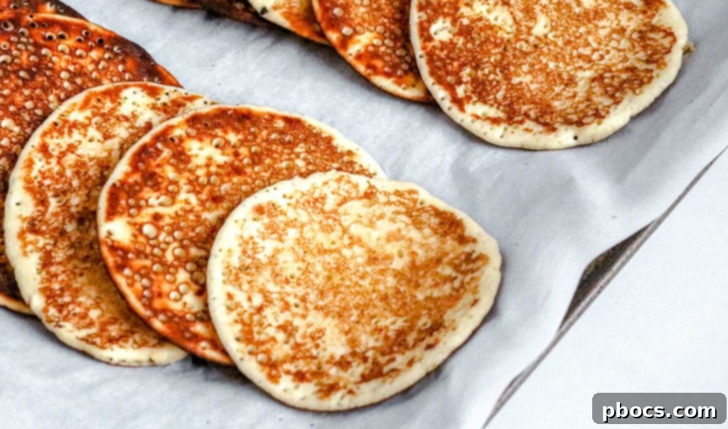 Cooking keto strawberry pancakes on a griddle