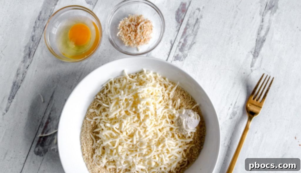 Almond flour, baking powder, and onion powder in a bowl