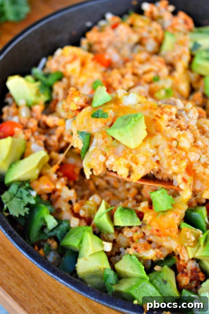 Close-up of the Keto Turkey Mexican Skillet, showing the vibrant texture of the cooked ground turkey, diced vegetables, and fragrant spices.
