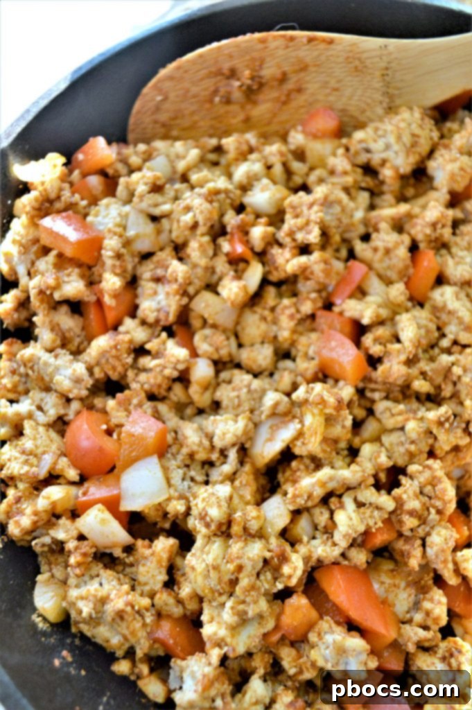 Ground turkey browning in a skillet, ready for the next ingredients to be added for the Mexican skillet.