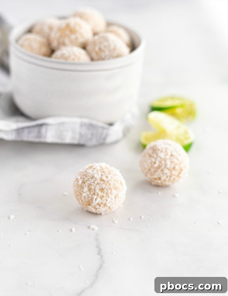 Refreshing Keto Key Lime Fat Bombs 4 Several Keto Key Lime Fat Bombs beautifully arranged on a white plate, with fresh lime slices in the background.