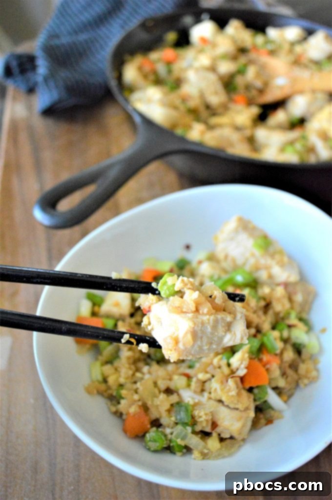 Keto Cauliflower Chicken Fried Rice stored in meal prep containers