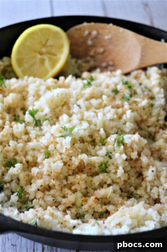 Flavorful Garlic Butter Cauliflower Rice 6 Garlic Butter Cauliflower Rice with added mix-ins in a skillet.