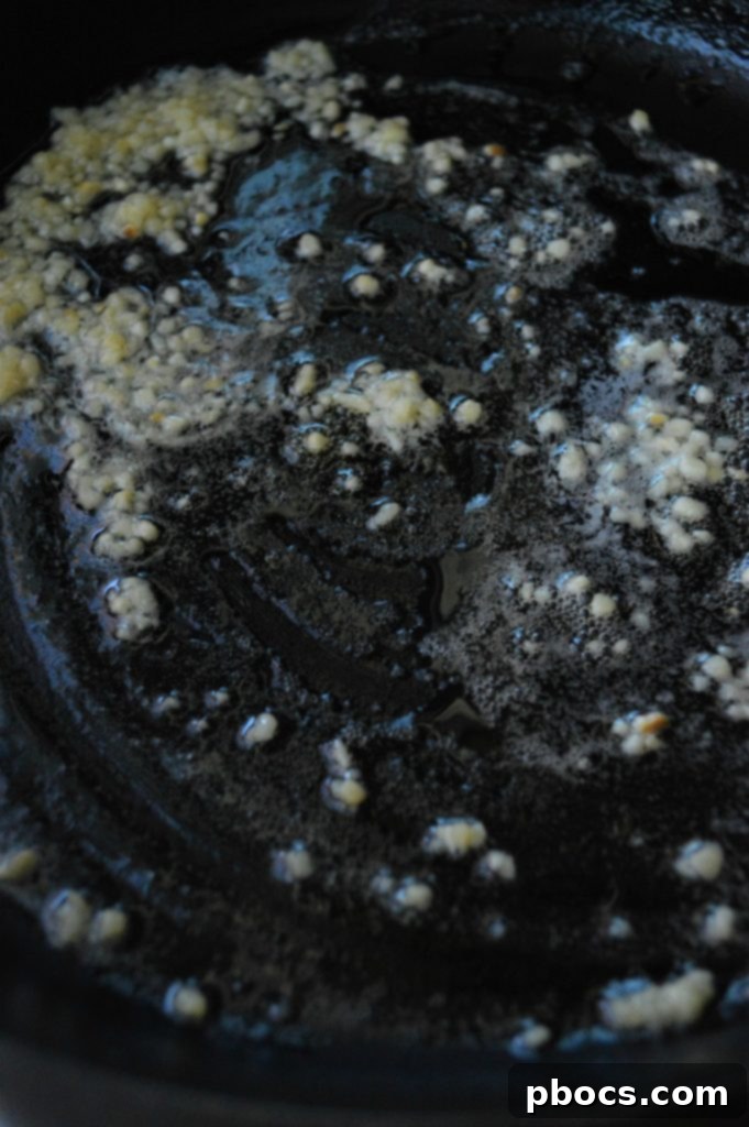 Flavorful Garlic Butter Cauliflower Rice 7 Butter melting in a hot skillet for cauliflower rice.