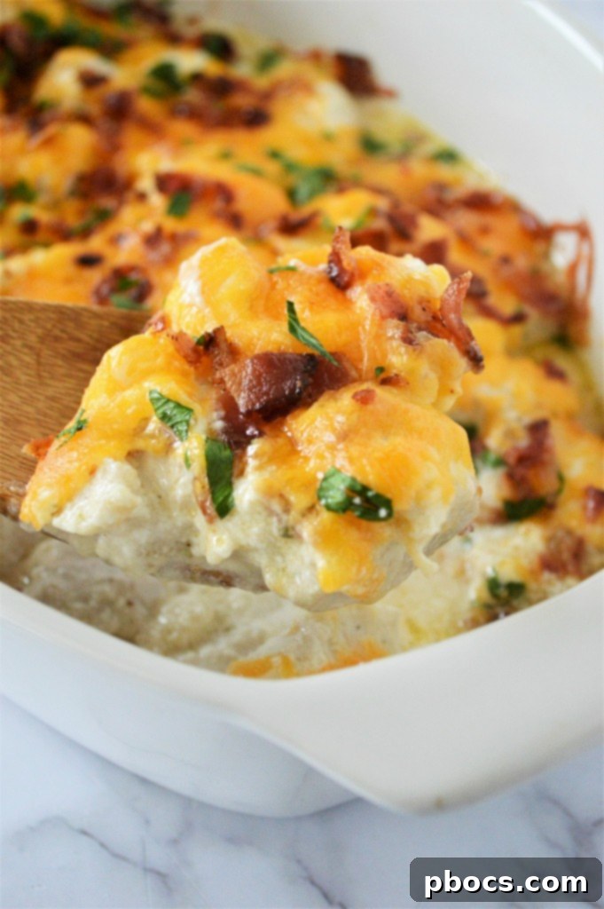 Close-up of baked Keto Chicken Bacon Ranch Casserole with melted cheese