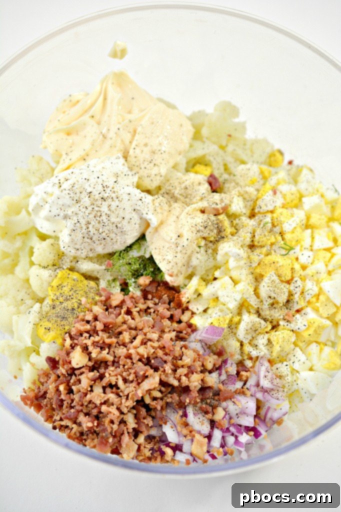 Mixing Ingredients for Deviled Egg Cauliflower Salad