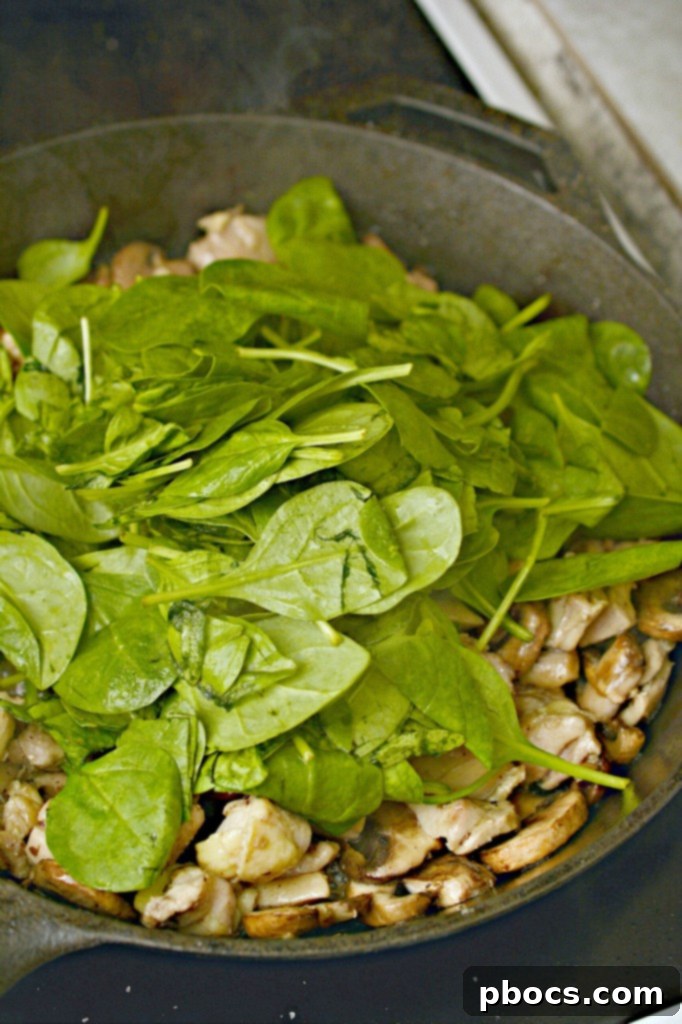 Step 3: Adding mushrooms to the chicken in the skillet