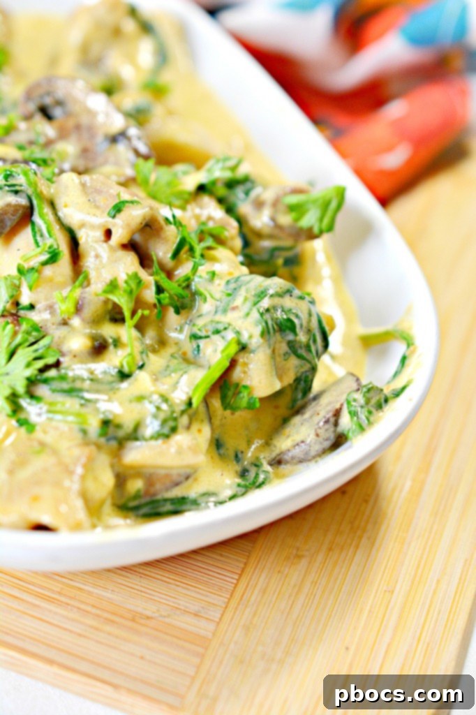Sauteed mushrooms and spinach in the creamy pumpkin alfredo sauce