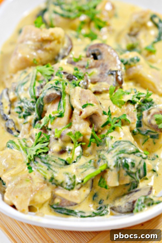 Low-Carb Chicken Pumpkin Alfredo served in bowls with a side