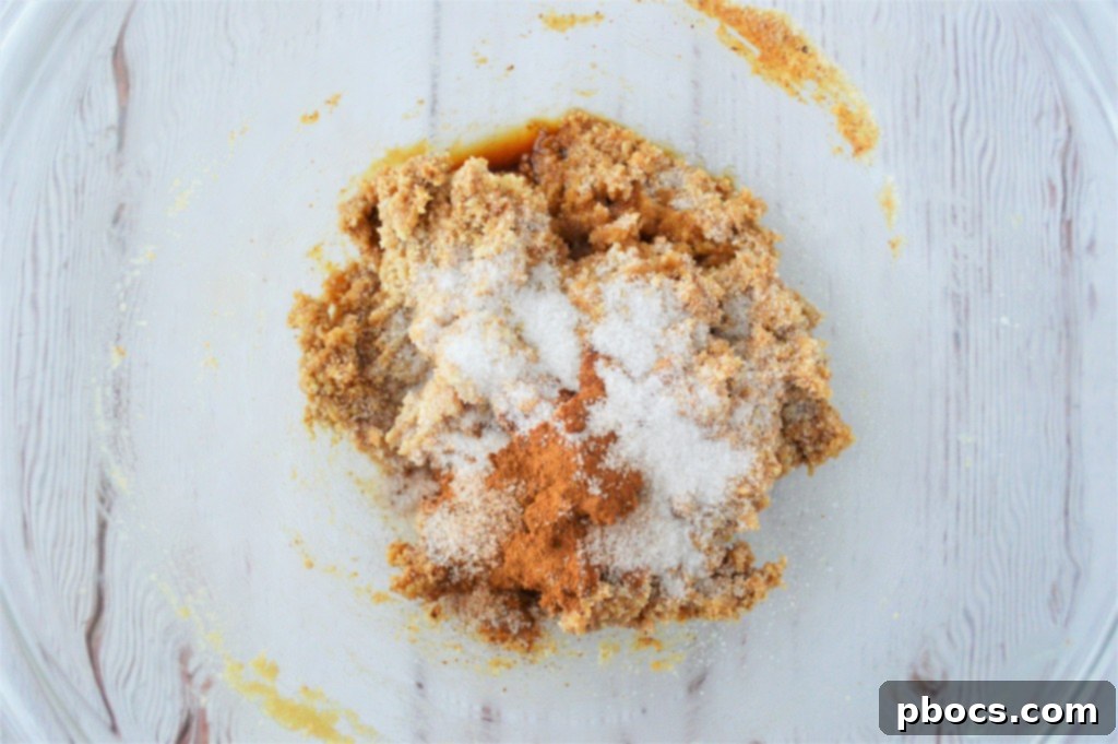Adding spices and sweetener to snickerdoodle dough