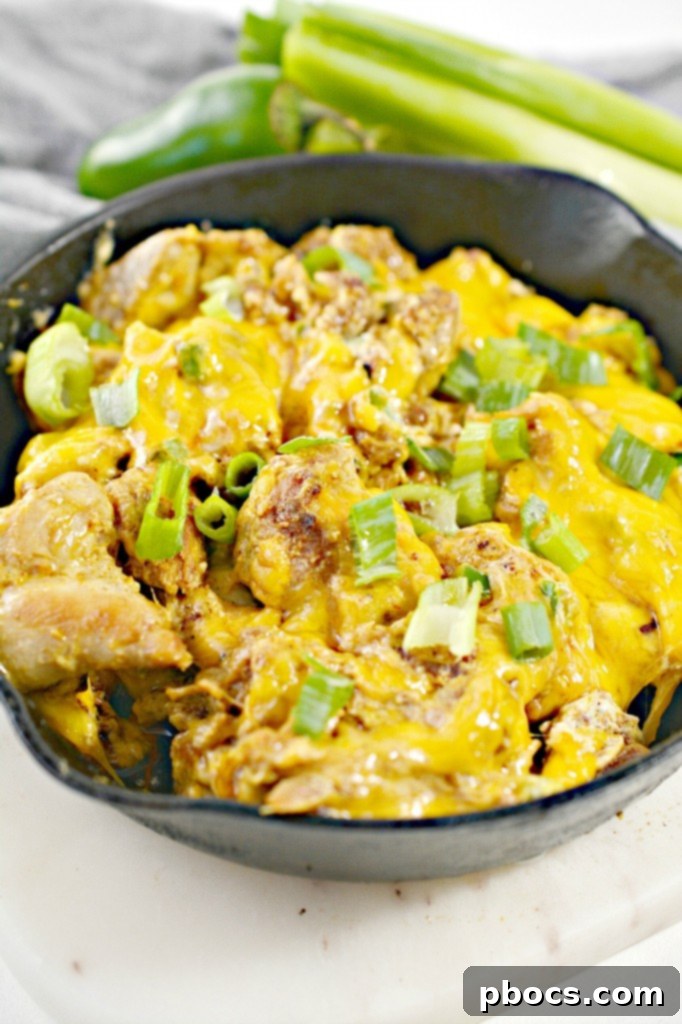 Keto Jalapeno Popper Chicken Skillet 2 Rich and creamy Low Carb Jalapeno Popper Chicken Skillet with melted cheese and vibrant green onions