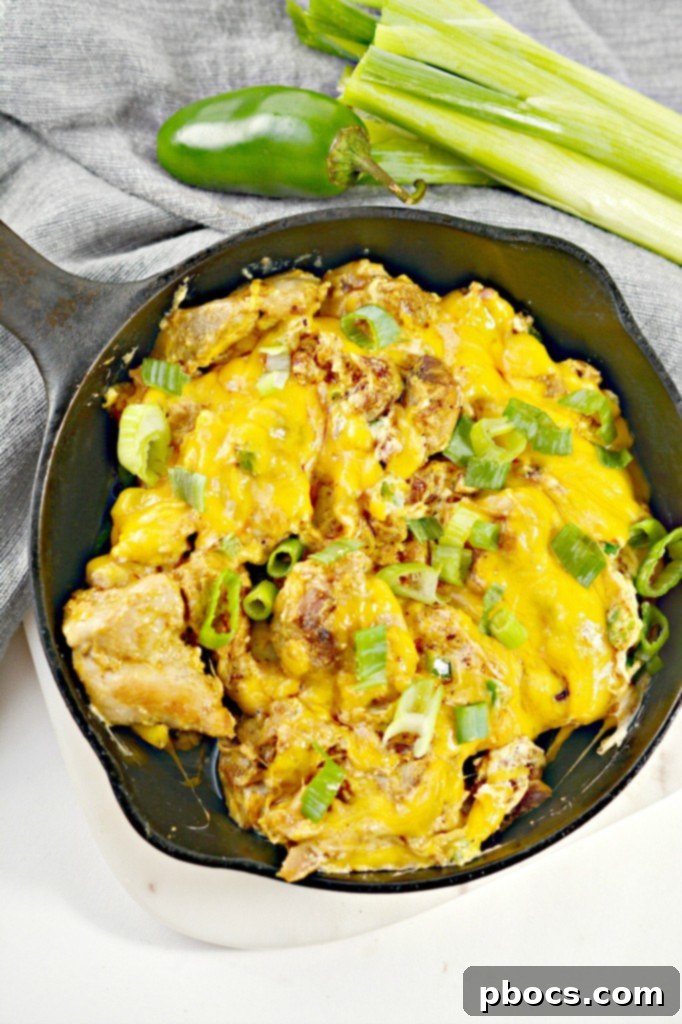 Keto Jalapeno Popper Chicken Skillet 4 Various ingredients for a Low Carb Jalapeno Popper Chicken Skillet laid out on a wooden board
