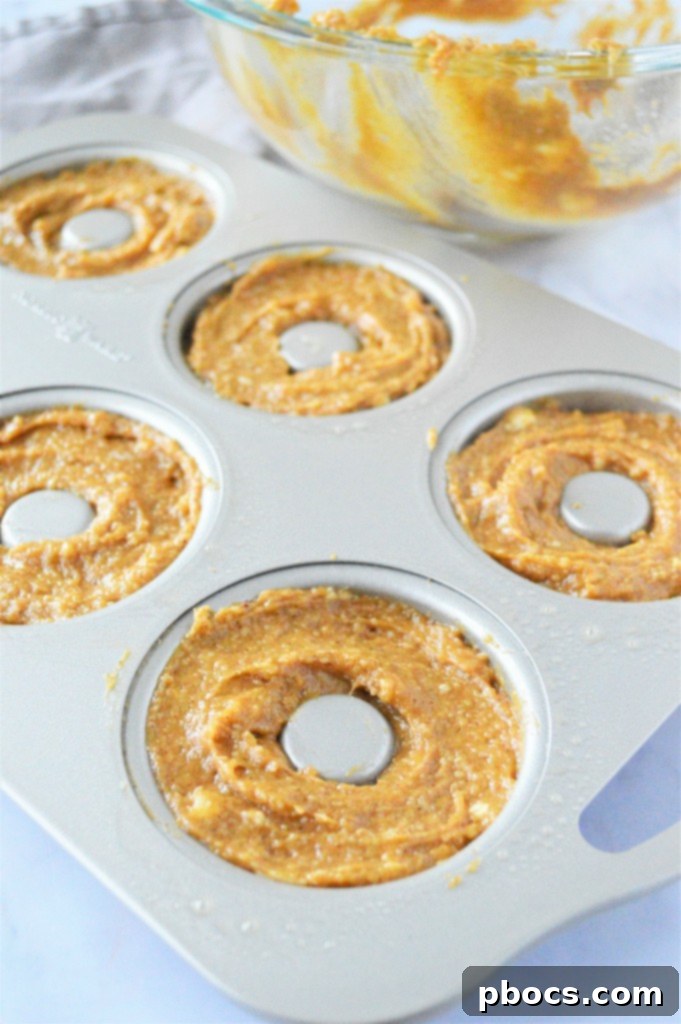 Adding wet to dry ingredients for keto gingerbread donuts