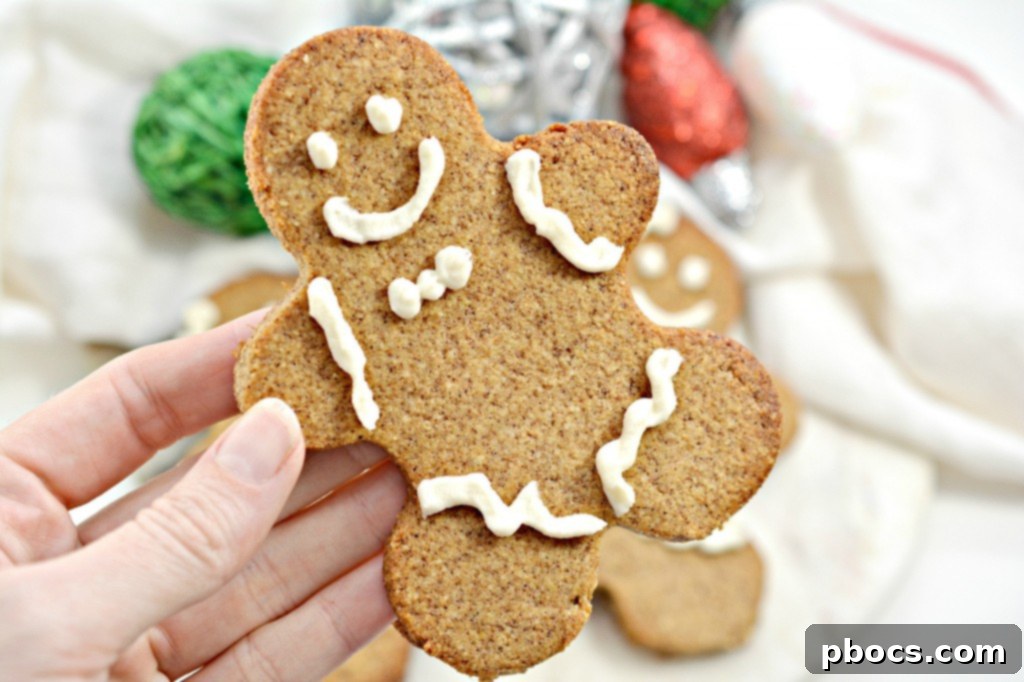 Festive Keto Gingerbread Snaps 5 A stack of beautifully decorated Keto Gingerbread Cookies