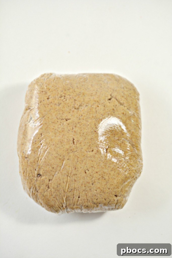 Festive Keto Gingerbread Snaps 9 Keto Gingerbread Cookie dough wrapped in plastic wrap