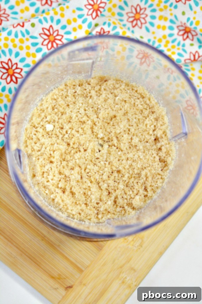 Spicy Keto Jalapeno Popper Green Bean Casserole 13 Step-by-step photo showing the green bean mixture layered evenly in a 9x13 inch baking dish