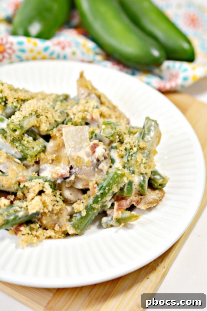 Spicy Keto Jalapeno Popper Green Bean Casserole 4 Freshly cooked Keto Jalapeno Popper Green Bean Casserole in a serving dish, ready to be enjoyed as a low-carb meal