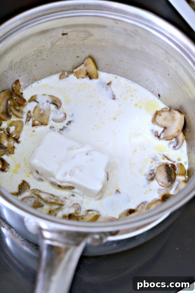 Spicy Keto Jalapeno Popper Green Bean Casserole 8 Step-by-step photo showing mushrooms sautéing in butter in a saucepan for the green bean casserole