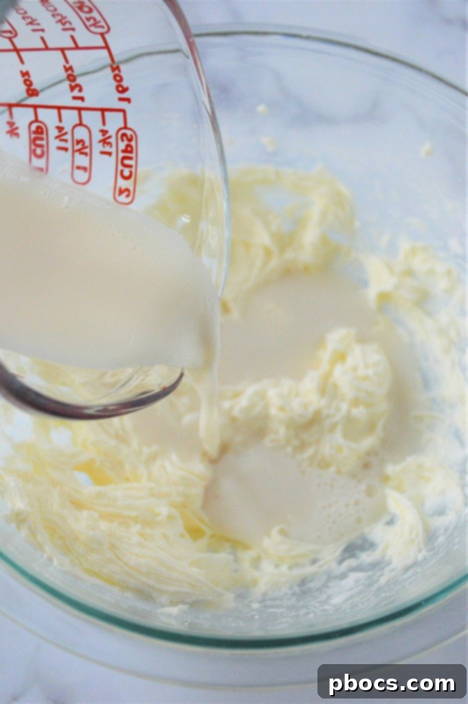 Keto Eggnog Cheesecake Bars 11 Mixing Cream Cheese for the Eggnog Cheesecake Filling