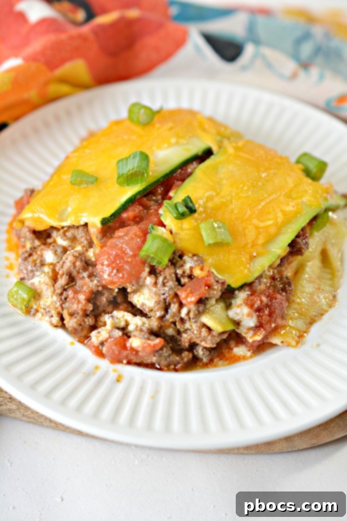 A vibrant and appetizing serving of Keto Zucchini Taco Lasagna.