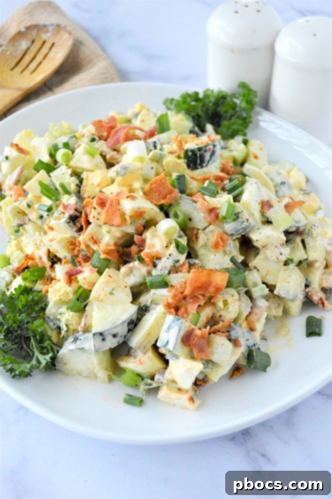 Close-up of creamy Low Carb Cucumber Egg Salad in a bowl, showing crunchy ingredients.