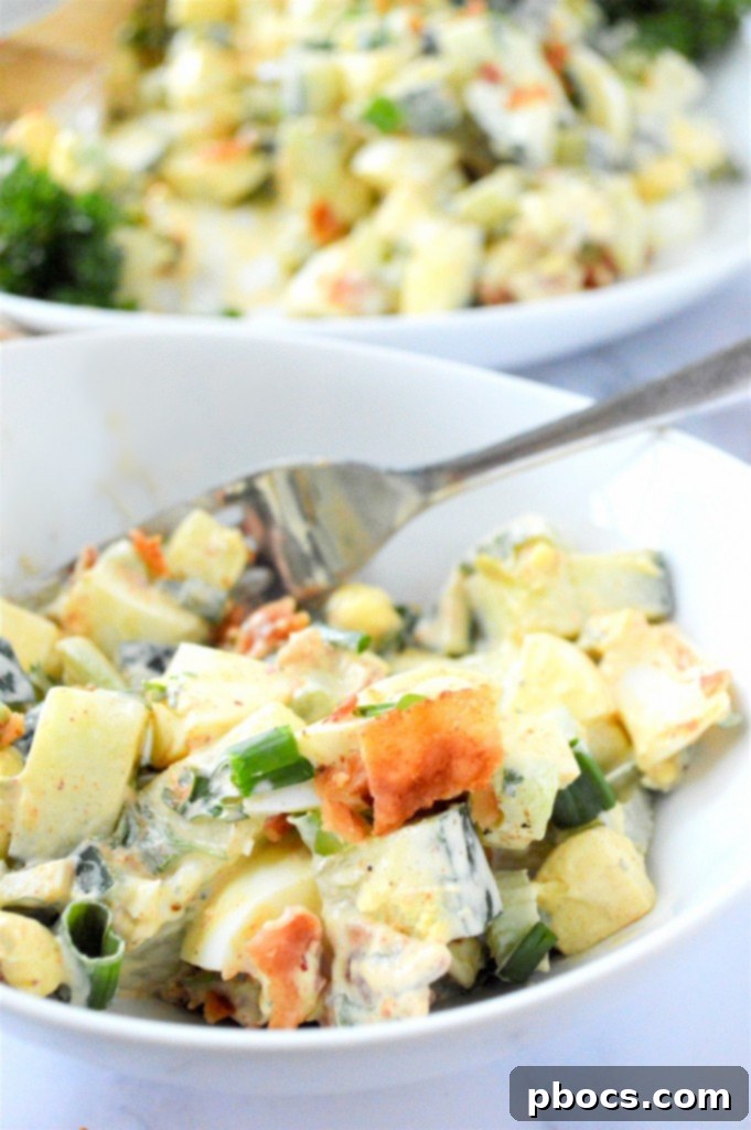 Overhead view of a large bowl of Low Carb Cucumber Egg Salad, ready to serve.