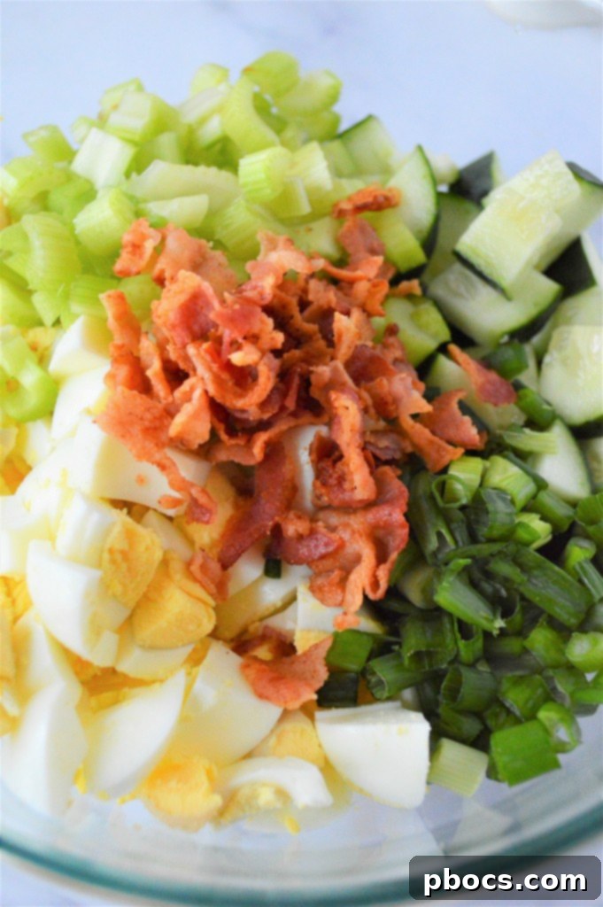 Step 2: Adding celery, bacon, and green onions to the bowl.