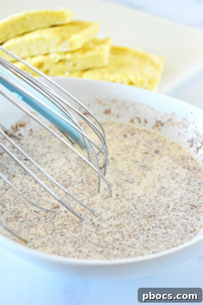 Whisking the eggnog French toast batter