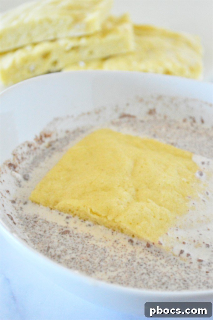 Dipping keto bread into eggnog mixture