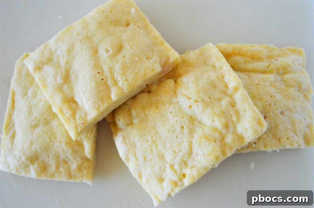 Golden-brown Eggnog Keto French Toast slices on a plate