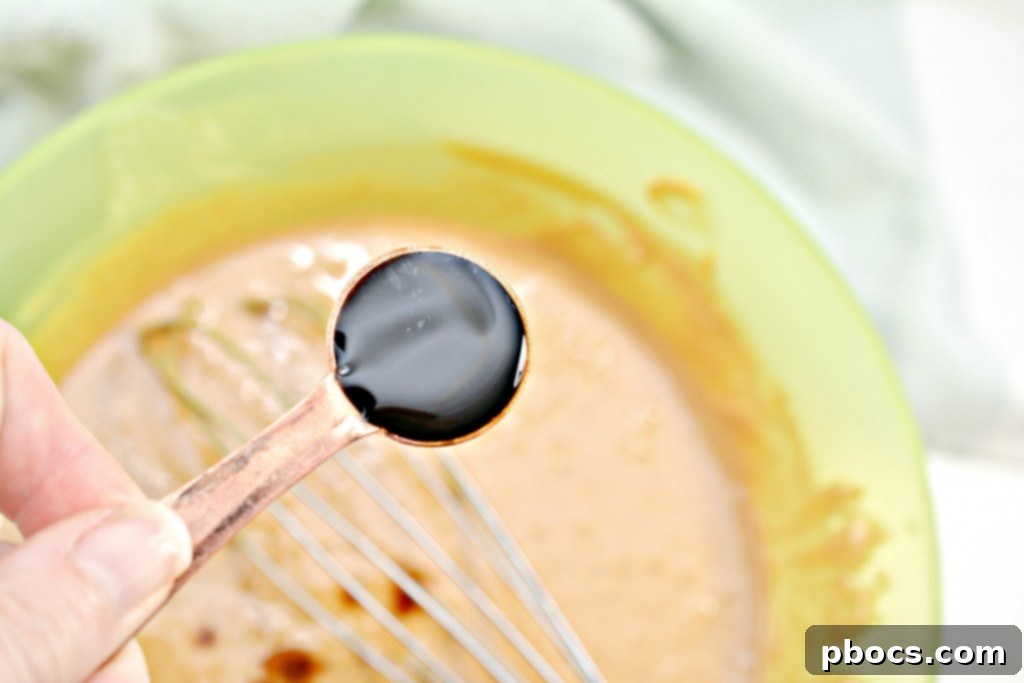 Stirring the fudge mixture after adding sweetener