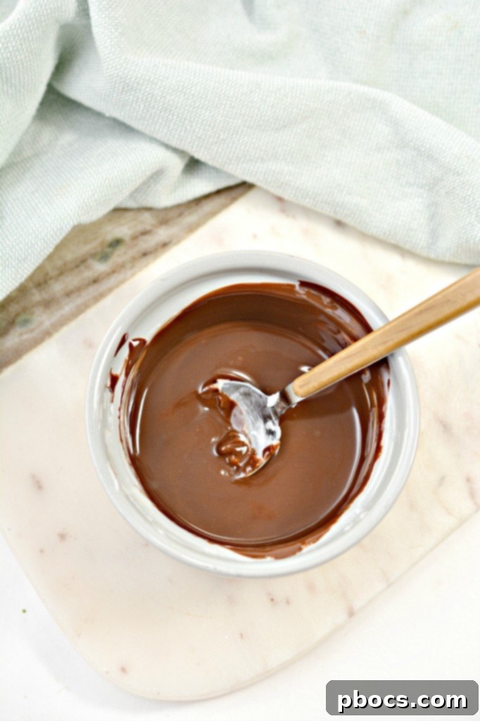 Keto fudge with chopped nuts ready to set