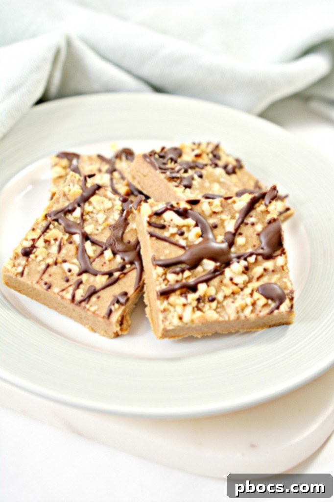 Close-up of a square of Keto Peanut Butter Fudge with a sprinkle of nuts