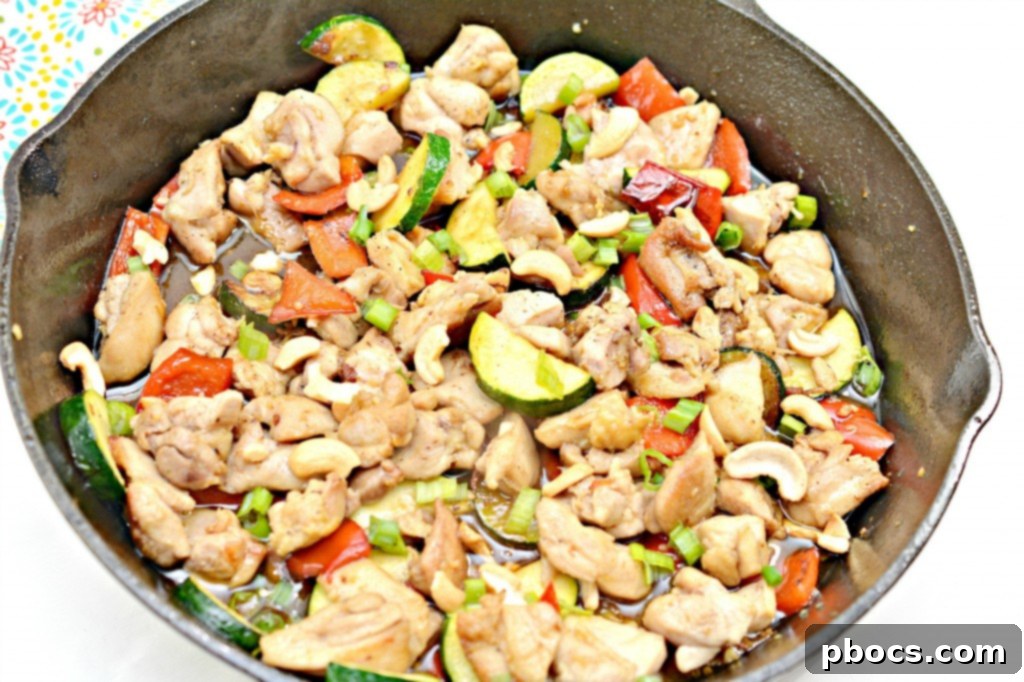 Homemade Kung Pao sauce being whisked in a bowl.