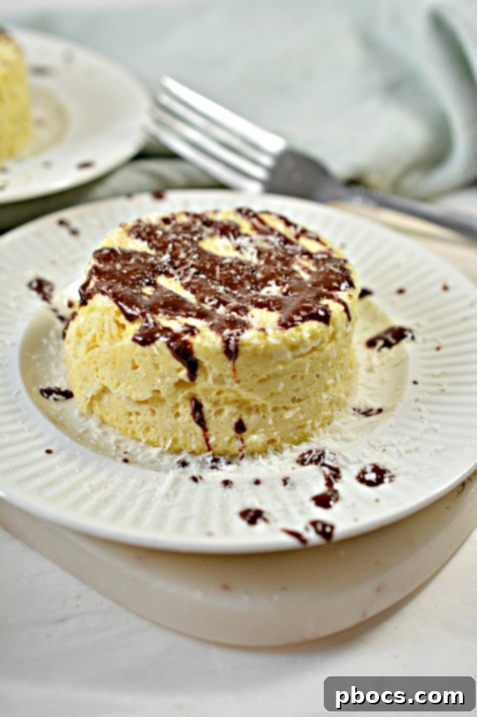 Effortless Keto Mug Cheesecake 8 A single keto mug cheesecake on a plate, ready to be eaten