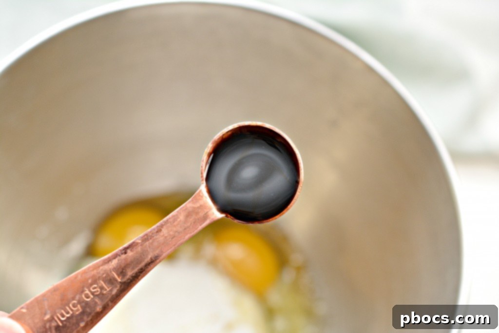 Effortless Keto Mug Cheesecake 10 Mixing cream cheese, eggs, vanilla, and sweetener