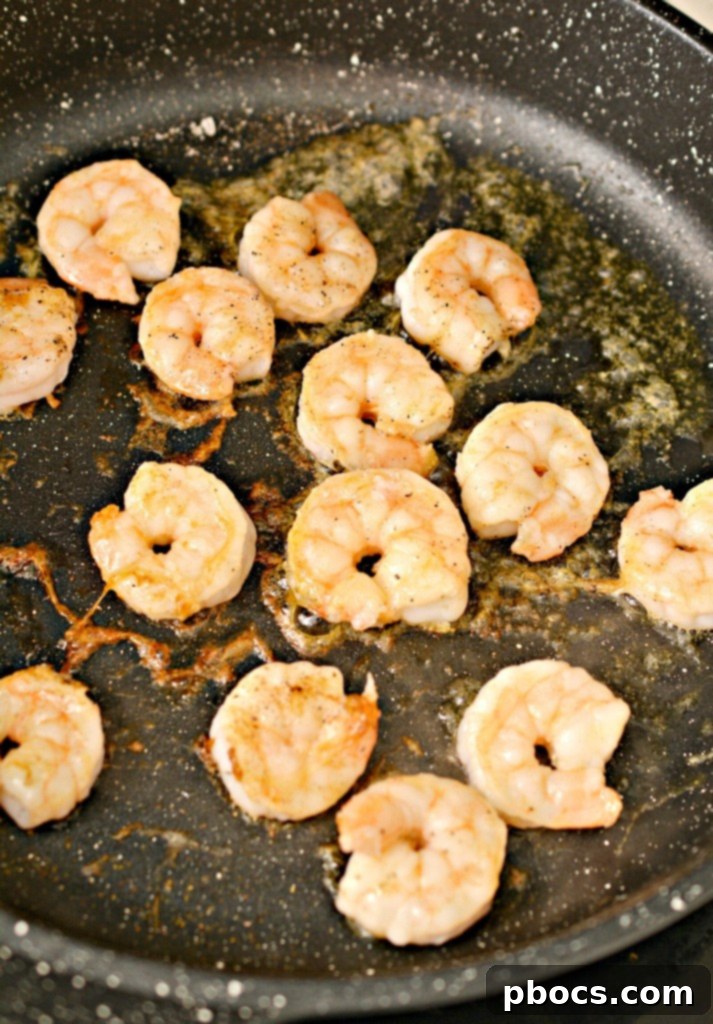 Cooking olive oil in a skillet for keto miso ramen