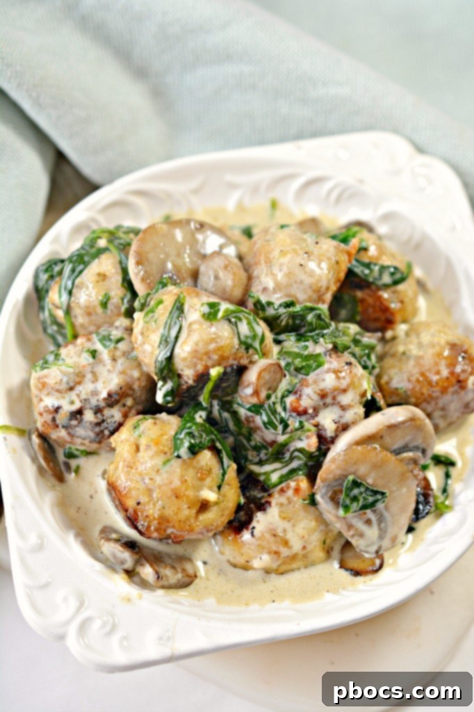 Flavor Packed Cajun Keto Chicken Meatballs 2 Delicious Keto Cajun Chicken Meatballs in creamy sauce, served with cauliflower rice