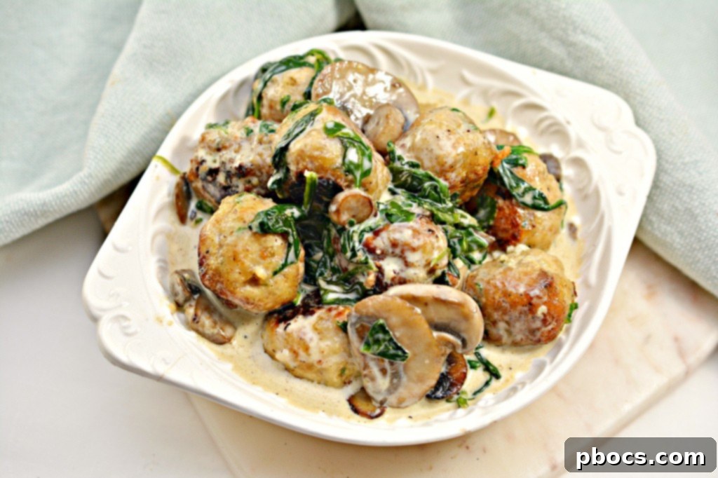 Flavor Packed Cajun Keto Chicken Meatballs 6 Keto Cajun Chicken Meatballs with creamy sauce over cauliflower rice