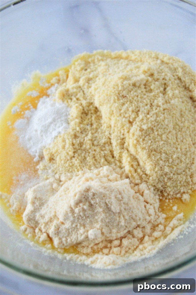 Flours, baking soda, and salt added to the batter