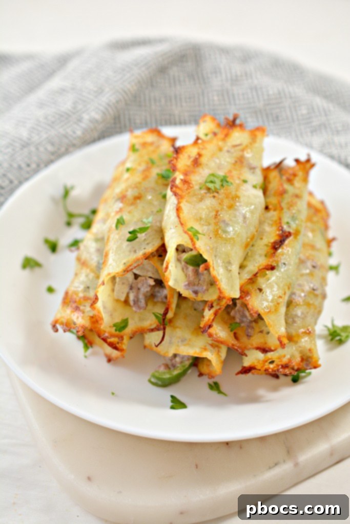 Delicious Keto Philly Cheesesteak Roll Ups arranged artfully on a serving plate