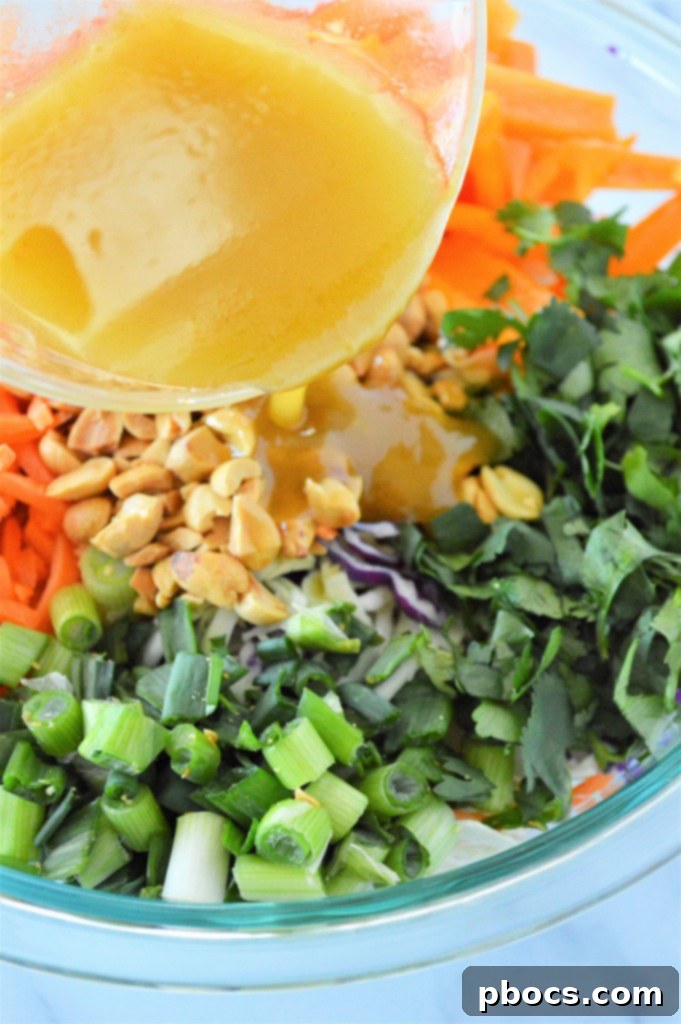 Zesty Keto Asian Slaw 7 Meal prep containers with separated Low Carb Asian Slaw and dressing