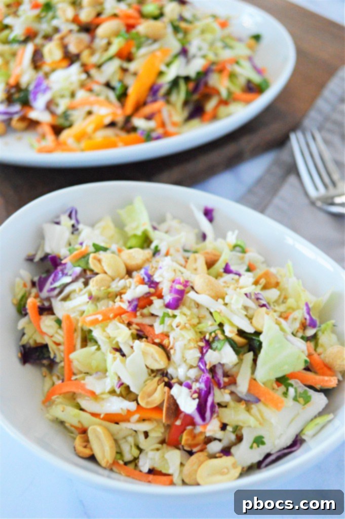 Zesty Keto Asian Slaw 9 Small bowl of orange ginger vinaigrette, highlighting its vibrant color