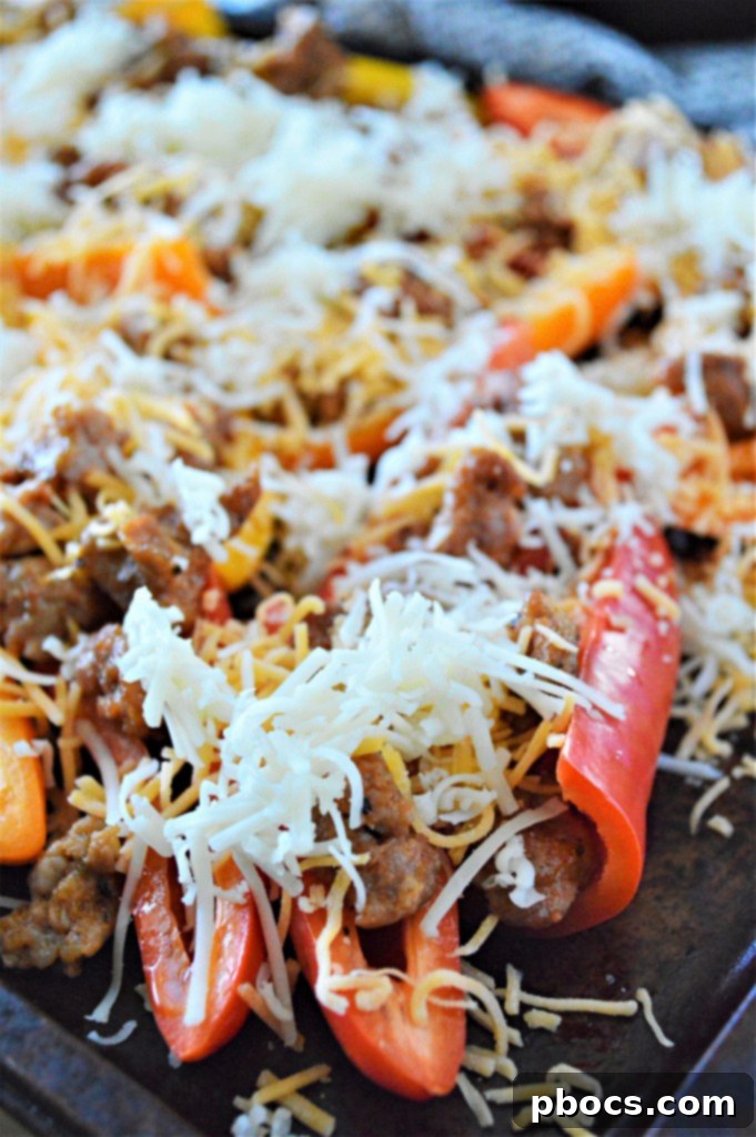 Stuffed Bell Pepper Nachos 11 Bell pepper nachos actively baking in the oven, with cheese melting and bubbling