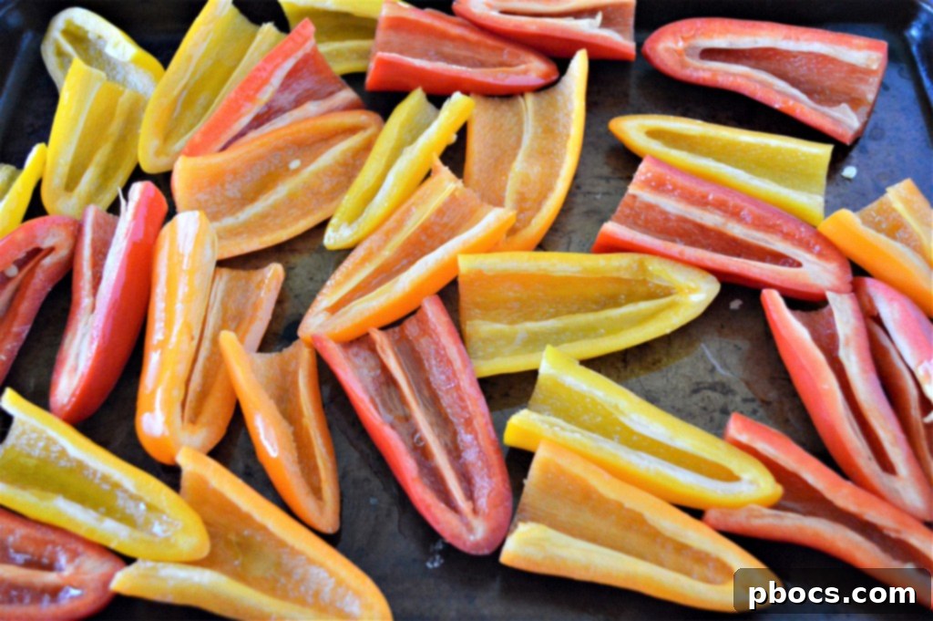 Stuffed Bell Pepper Nachos 8 Sliced bell peppers neatly arranged on a baking sheet, ready for the next step